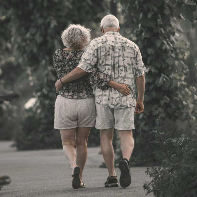 Aging With Vitality image – elder couple arm in arm